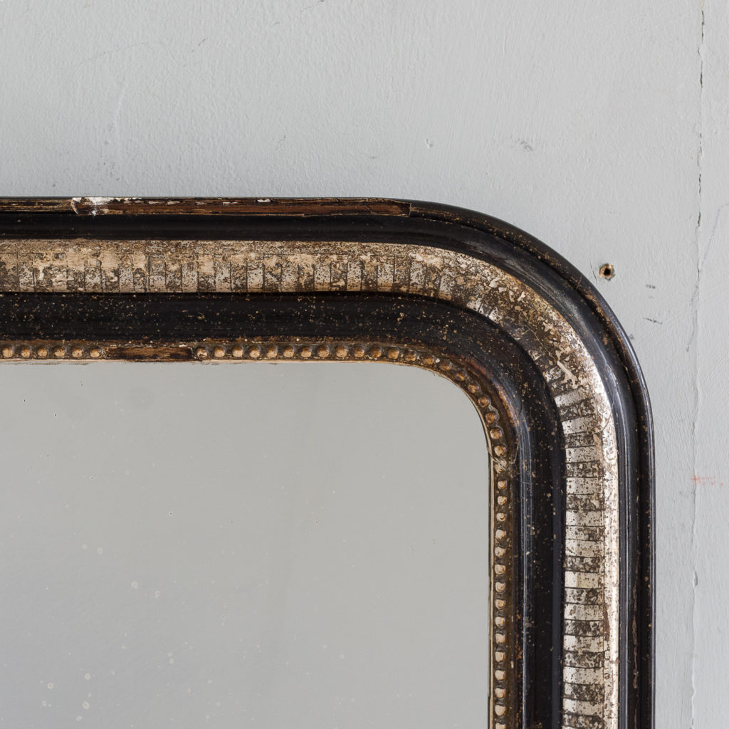 French ebonised and parcel silver-gilt wall mirror,-140000