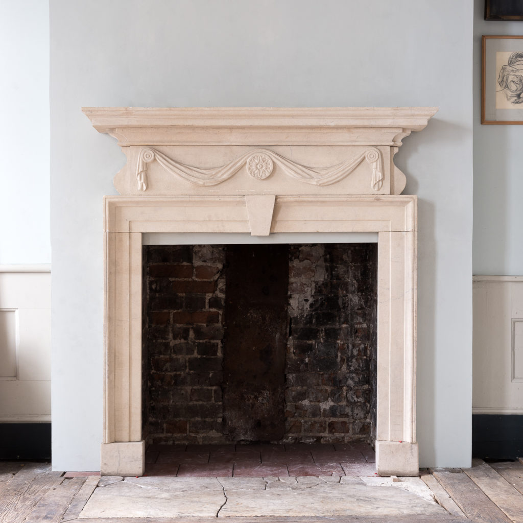 George II style limestone fireplace