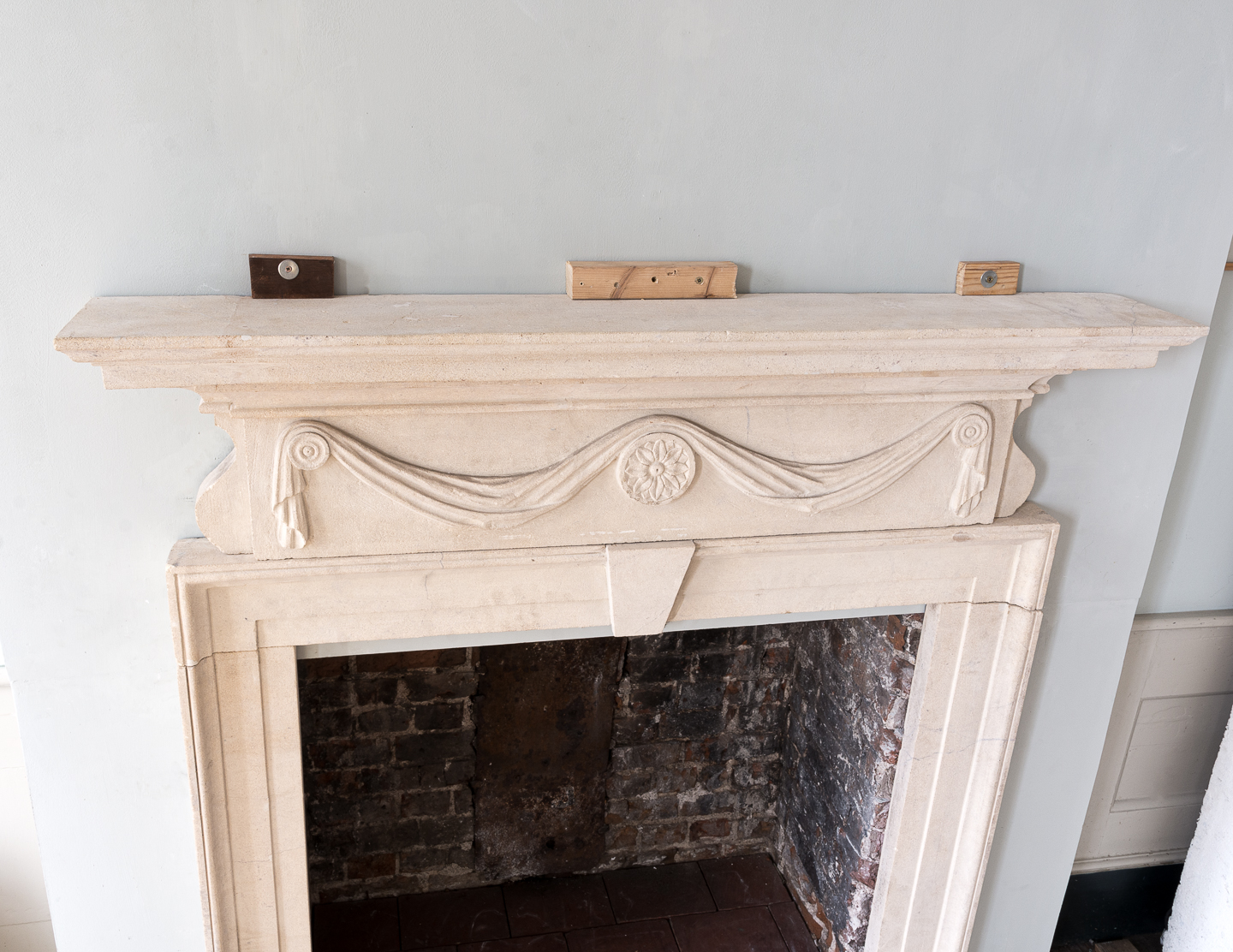 George II style limestone fireplace