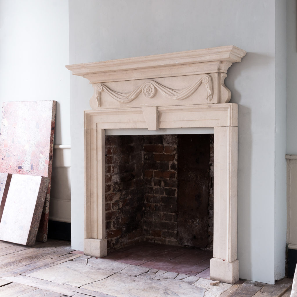 George II style limestone fireplace