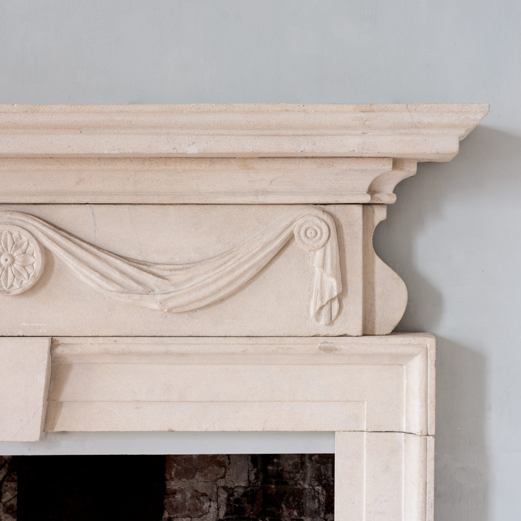 George II style limestone fireplace