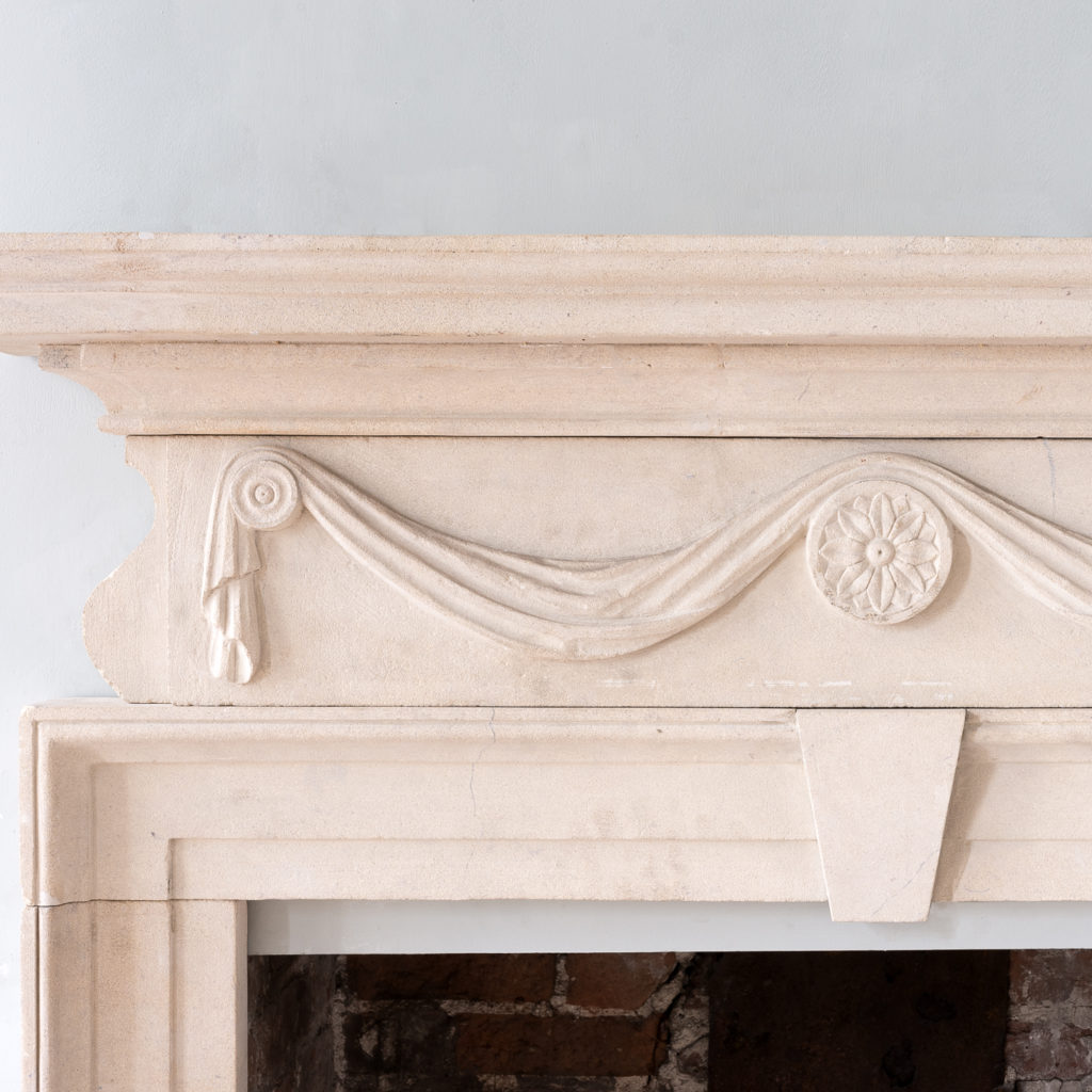 George II style limestone fireplace