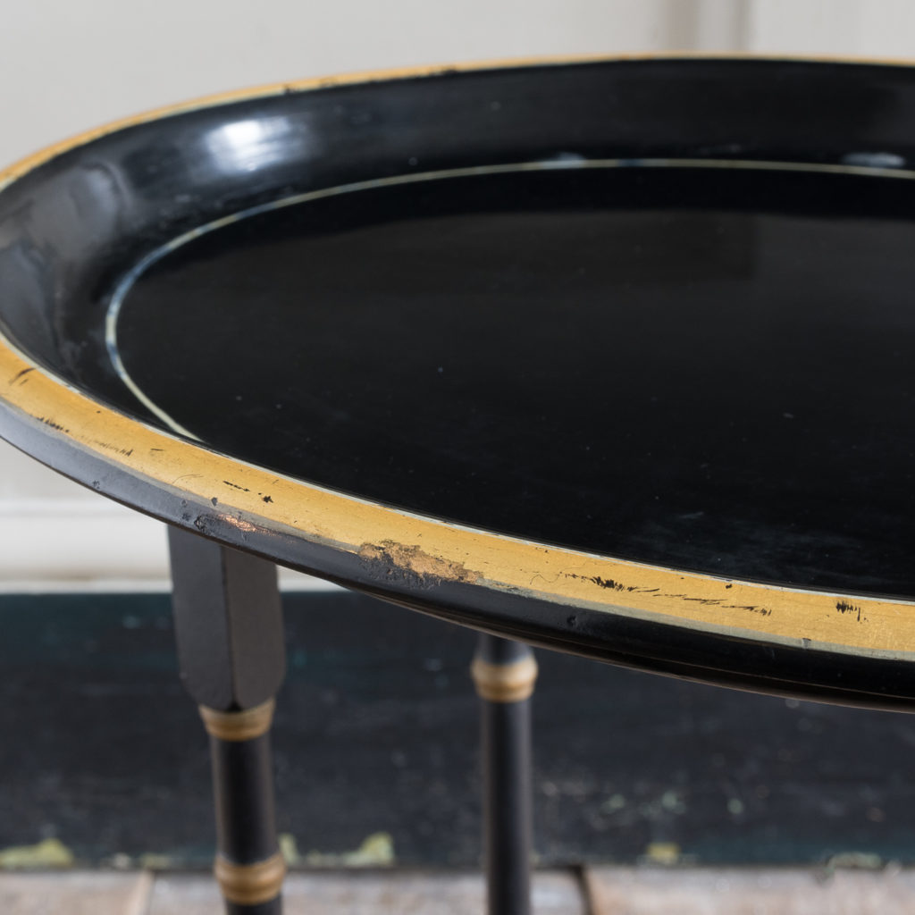 Victorian style ebonised and parcel-gilt tray top table