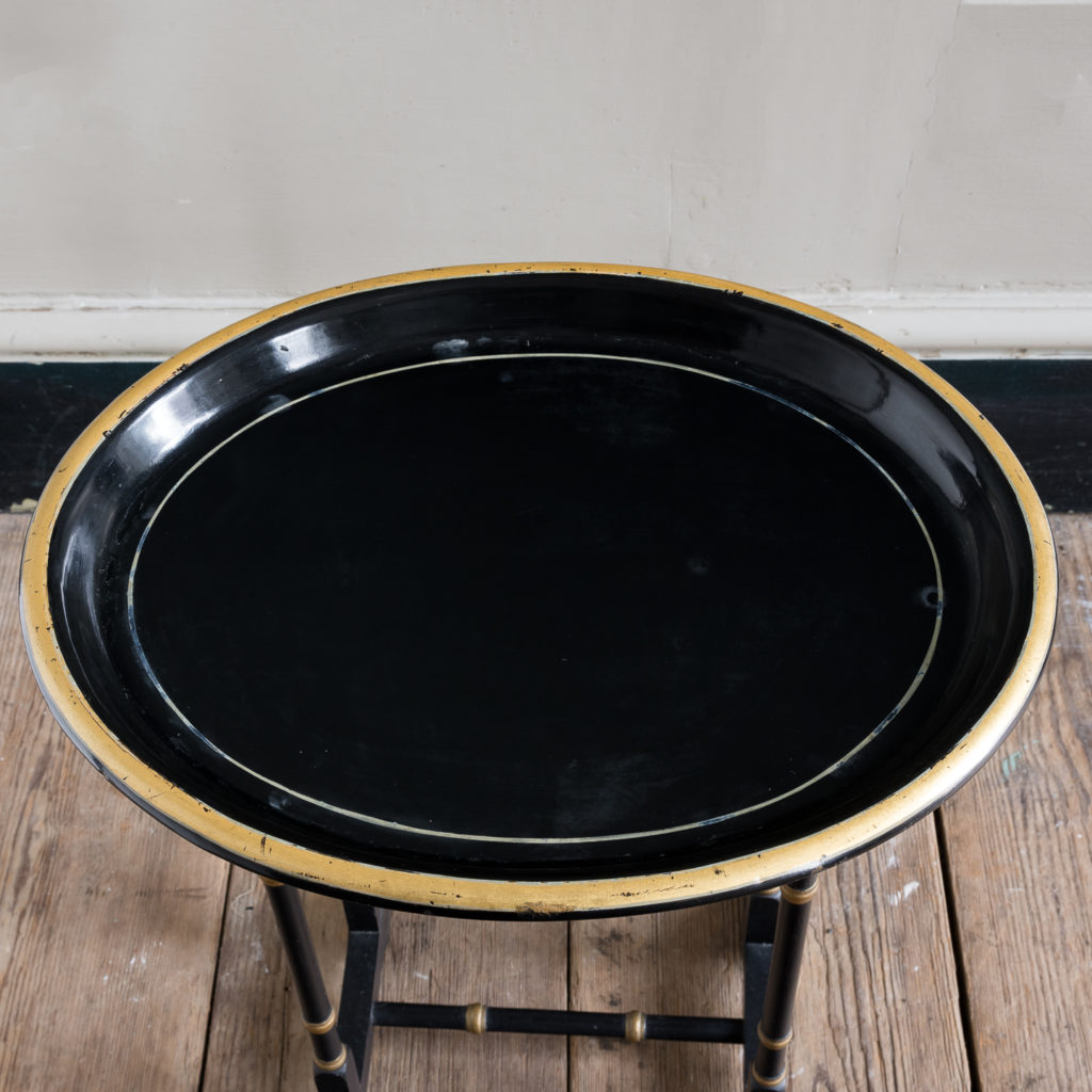 Victorian style ebonised and parcel-gilt tray top table