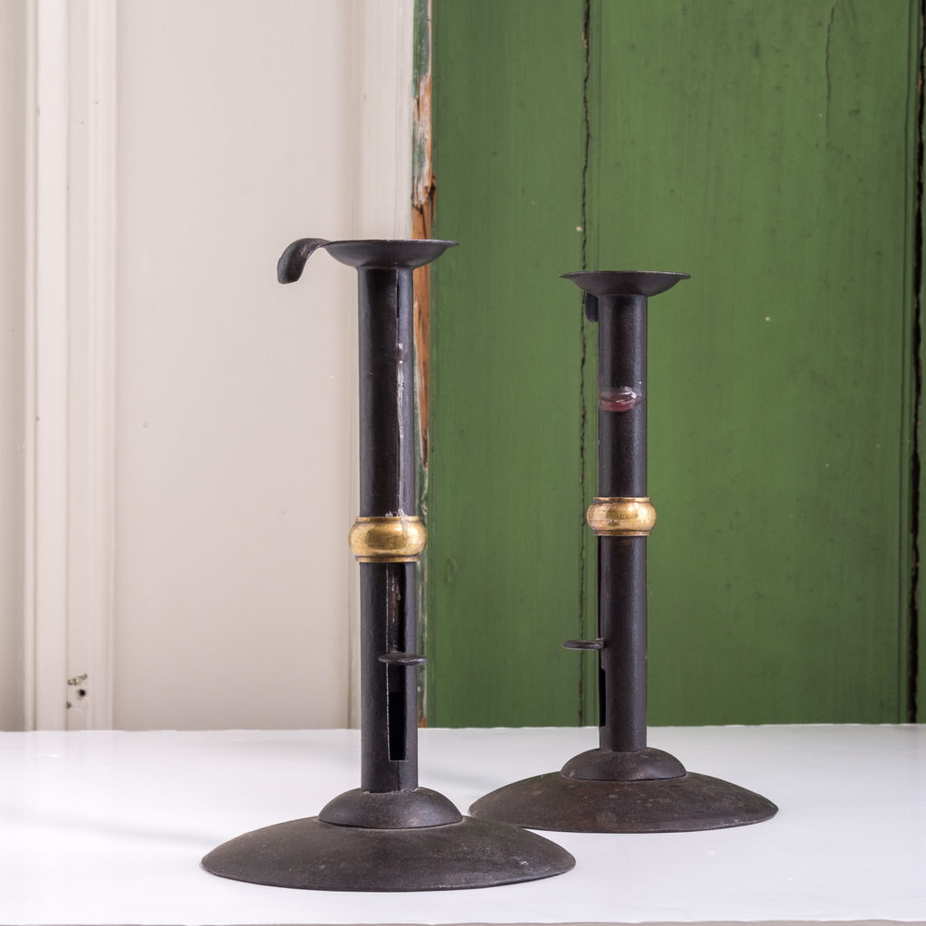 Sheet iron and brass collared hog scrapper candlesticks