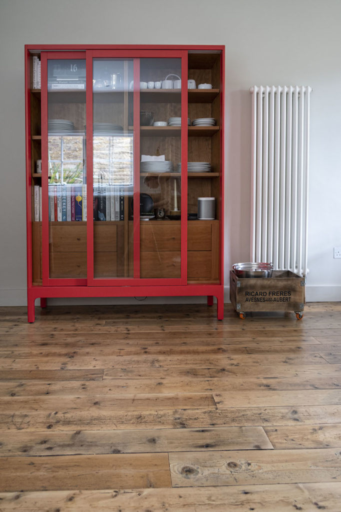 kitchen with modern cabinets and old timber