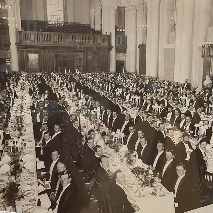 A banquet in the school hall - if photographed after 1935, the Nuseum Chimneypoiece is hidden beneath their feet