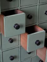 A bank of pine workshop drawers,