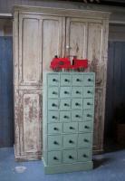A bank of pine workshop drawers,
